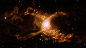 Huge waves are sculpted in this two-lobed nebula called the Red Spider Nebula.